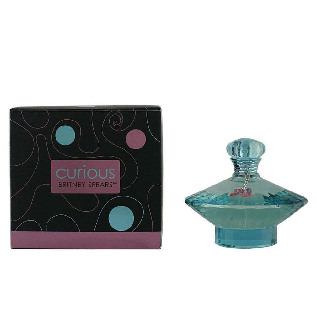 Flacon de parfum bleu et boîte. La boîte porte l'inscription "Curious Britney Spears".