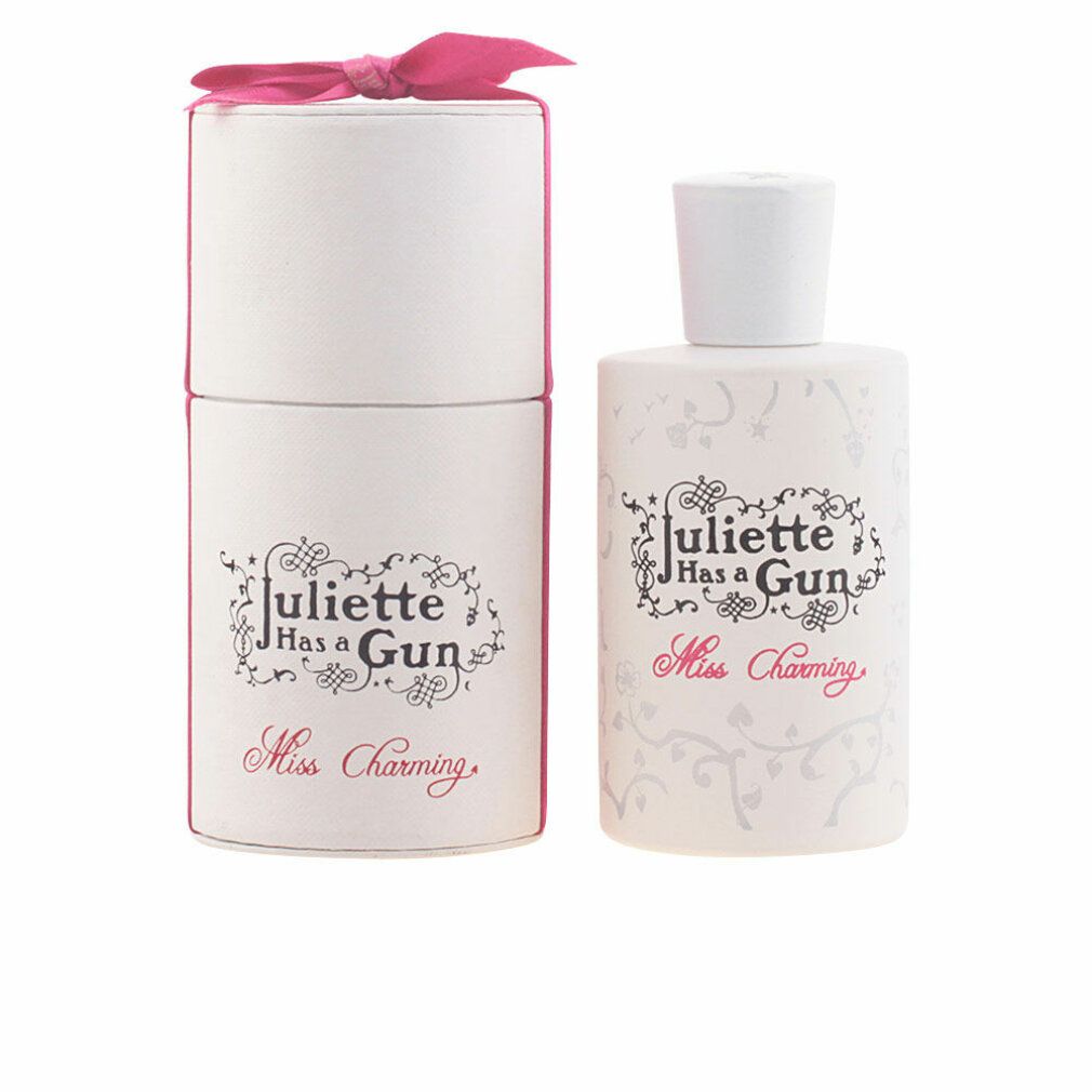 Parfumfles en verpakking. Wit, roze strik. Opschrift: Juliette Has a Gun, Miss Charming.