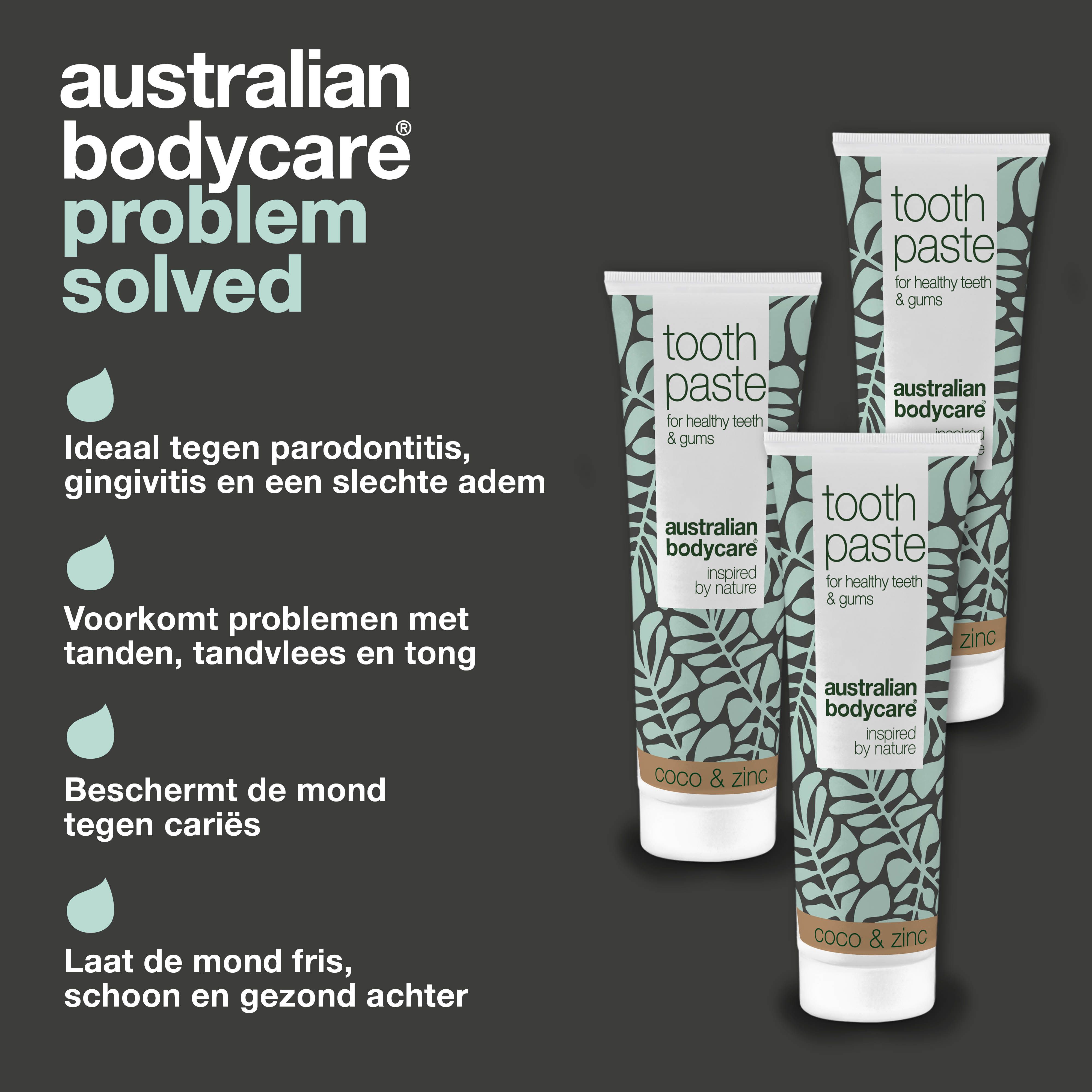 Probleem-oplossing concept. Vrouw poetst haar tanden. Daarnaast drie tubes tandpasta. Opschrift: Australian Bodycare.