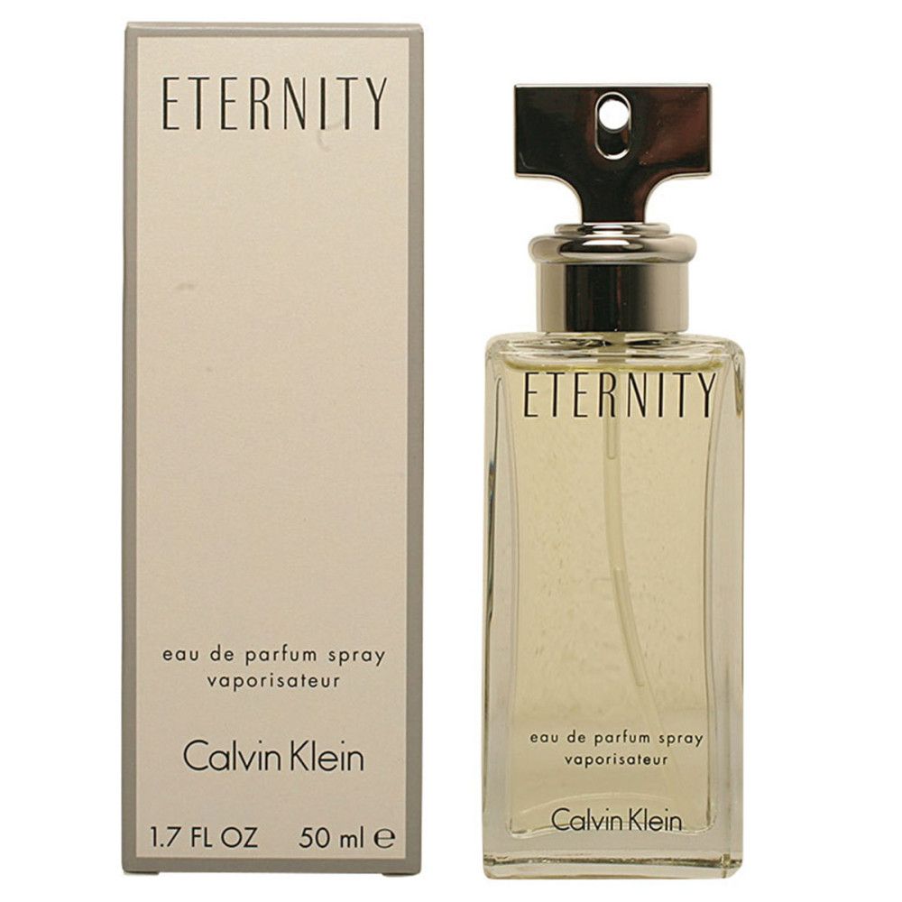 Flacon de parfum rectangulaire avec bouchon argenté et boîte. Inscription : Eternity, Calvin Klein.