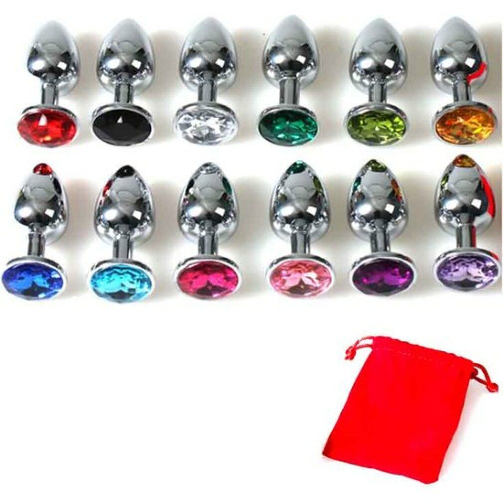 Gamme de plugs anals avec différentes décorations en cristal coloré et une pochette rouge.
