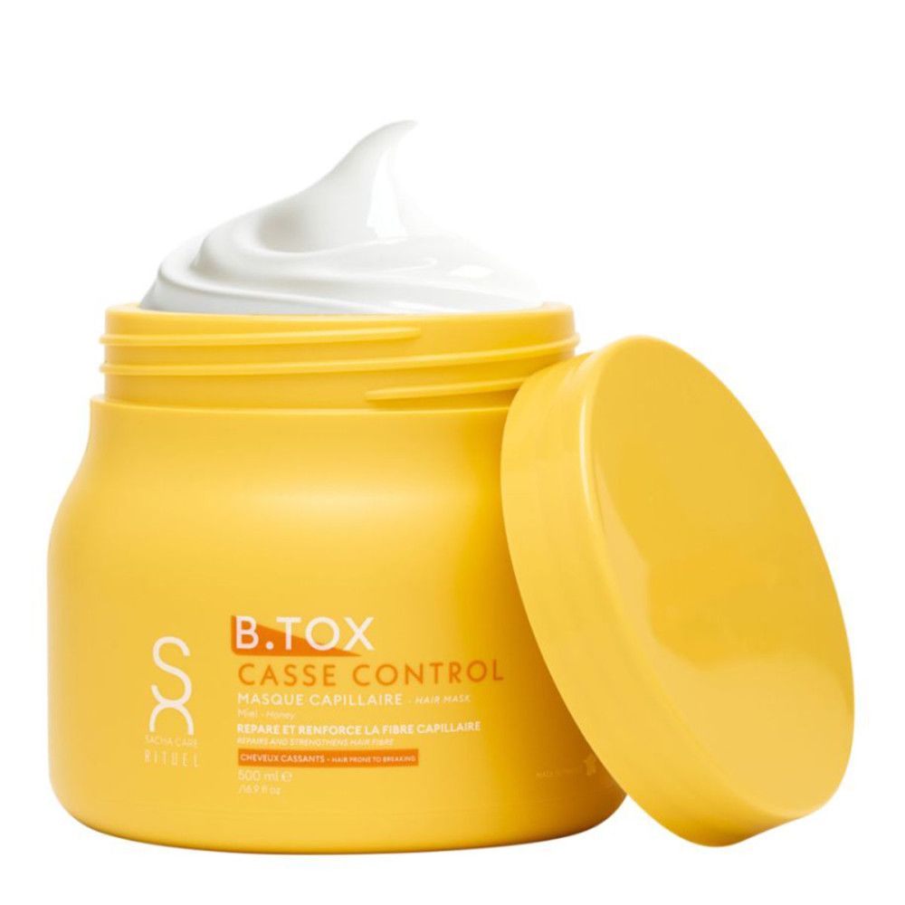 Geel potje met witte crème. Open deksel ernaast. Tekst: B.TOX Casse Control, Masque Capillaire. Merk: Sacha Care.