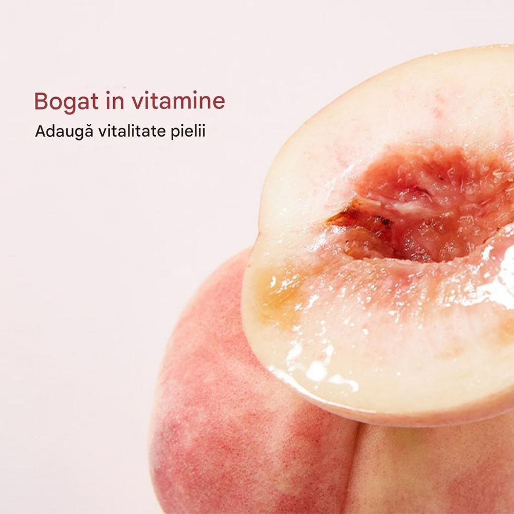 Gros plan de moitiés de pêche. Texte : Riche en vitamines, Ajoute de la vitalité à la peau.