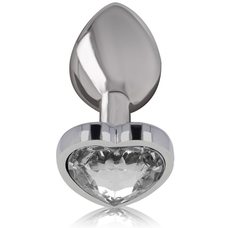Close-up van een zilveren anale plug met een hartvormige kristal.