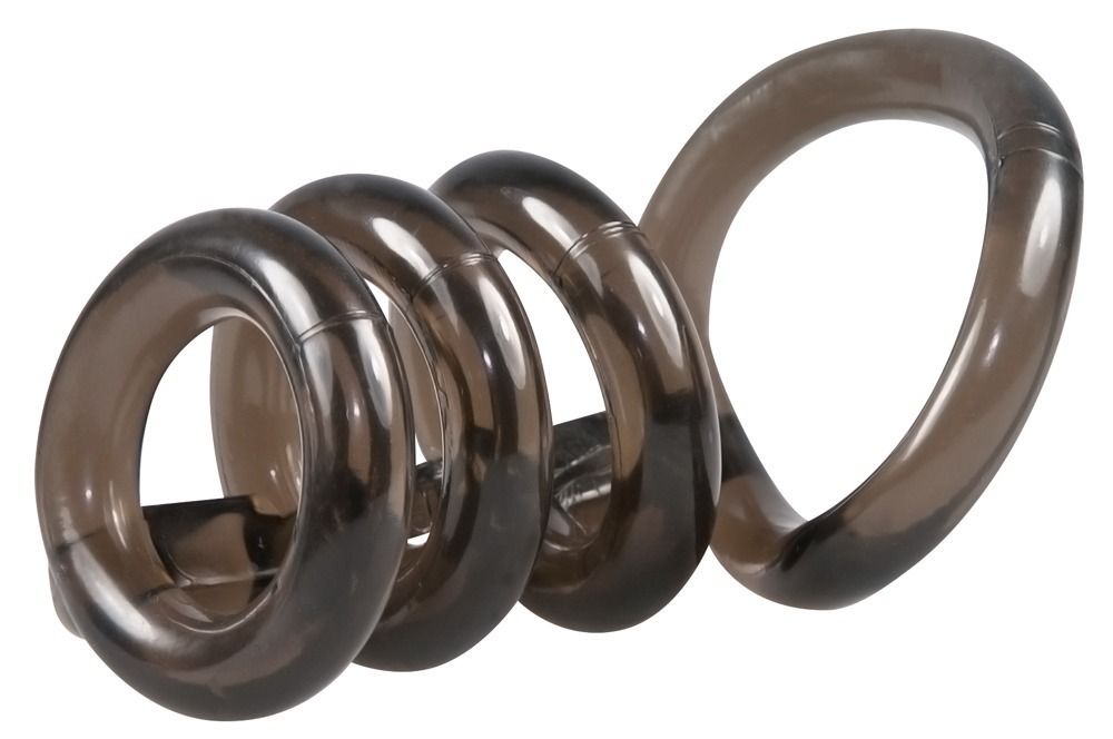 Cockring-set met ballenring, spiraalvormig. Donkere, transparante kleur. Van rubber of siliconen. Vier ringen.