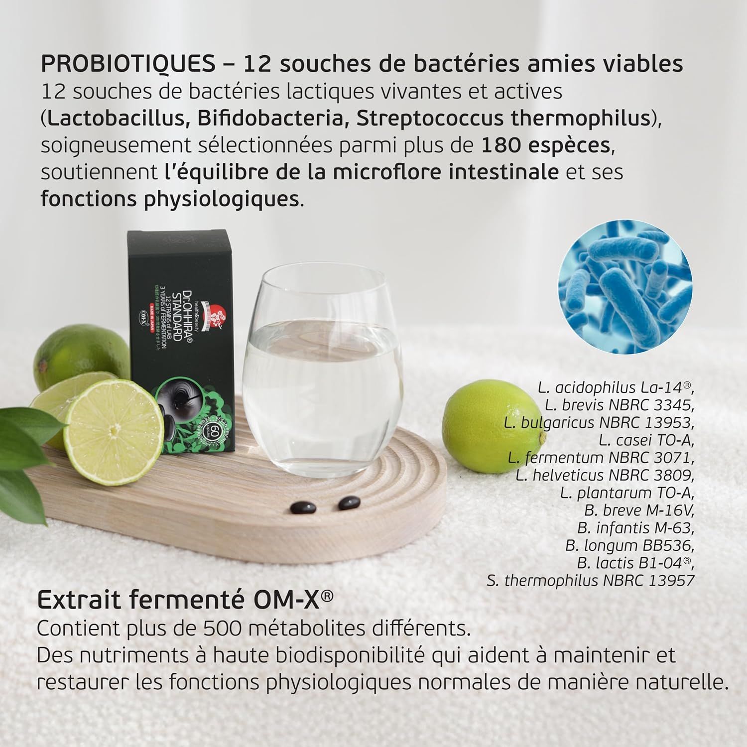 Emballage d'un complément probiotique avec verre d'eau, citrons verts et illustration de bactéries.
