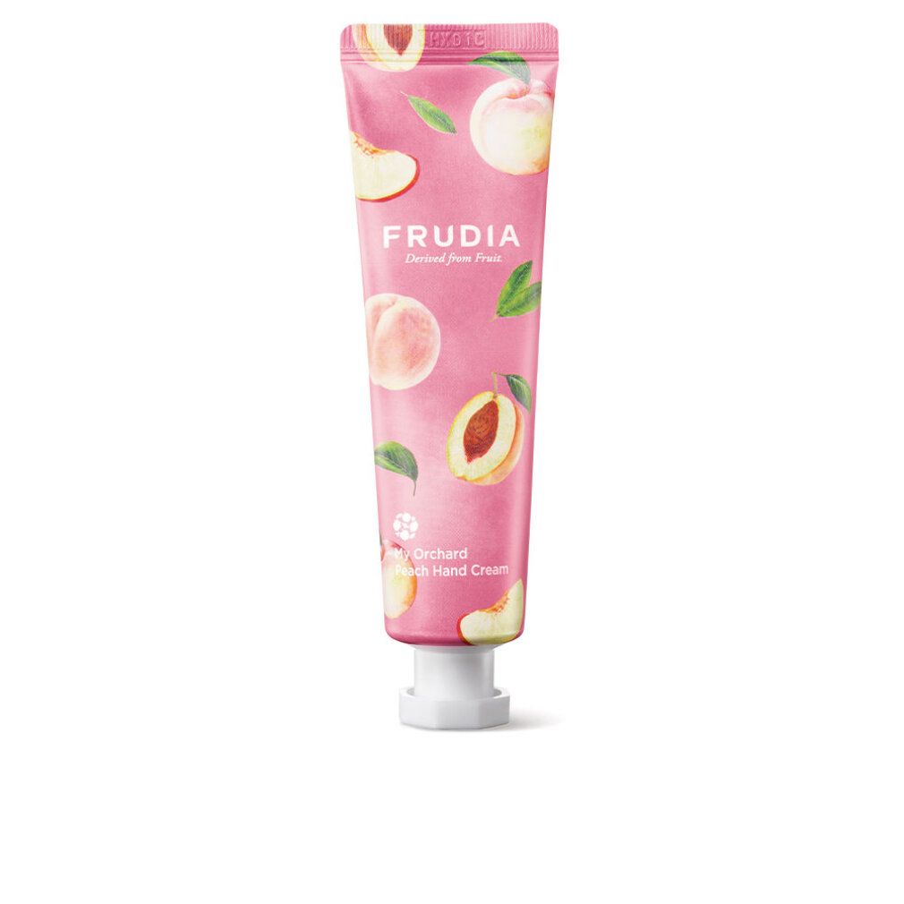 Roze tube met perzikmotief en opschrift FRUDIA. Productnaam: My Orchard Peach Hand Cream. Witte sluiting.