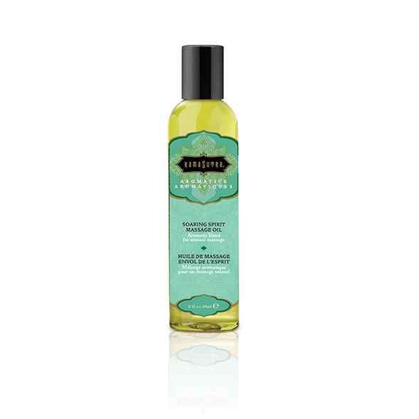 Massageolie in doorzichtige fles met zwarte dop. Turquoise etiket met gouden belettering.