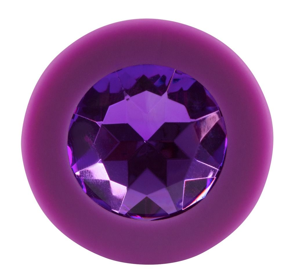 Plug anal violet avec bijou, gros plan sur le bijou.