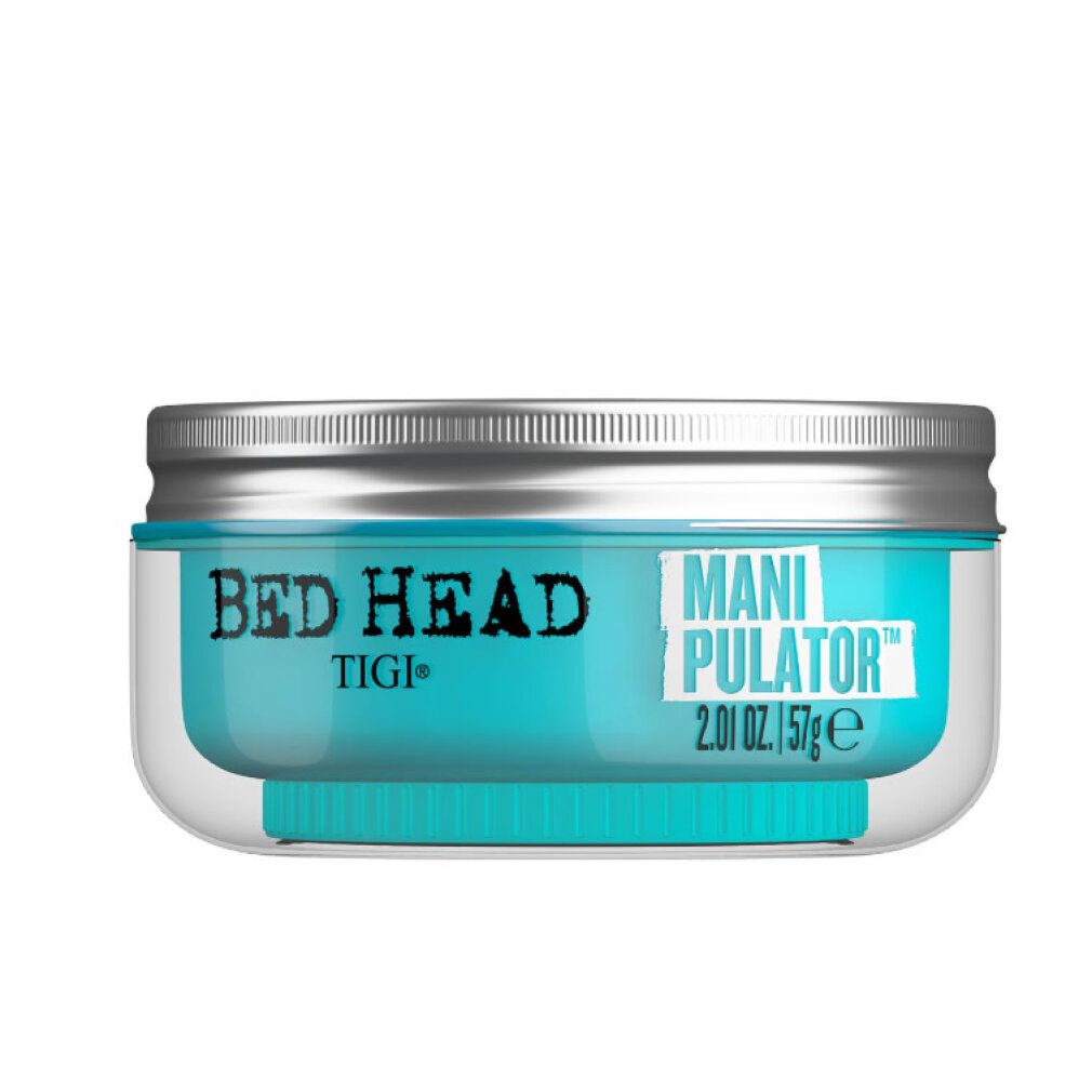 Tigi Bed Head Manipulator Matte Paste. Pot avec contenu bleu, couvercle argenté. Texte: Manipulator, 2.01 oz. / 57ge.