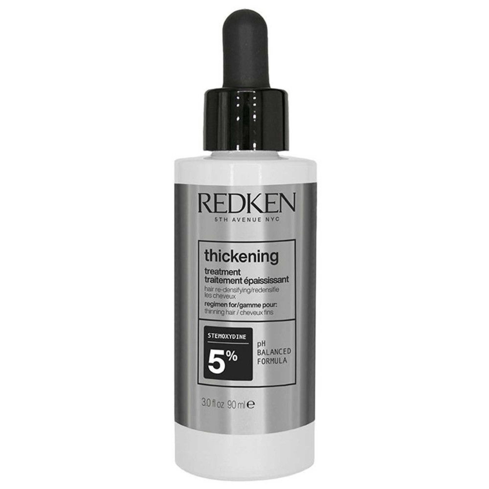 Redken-product met zwarte druppelaar. Opschrift: thickening treatment. Bevat 5% Stemoxydine. Witte fles.