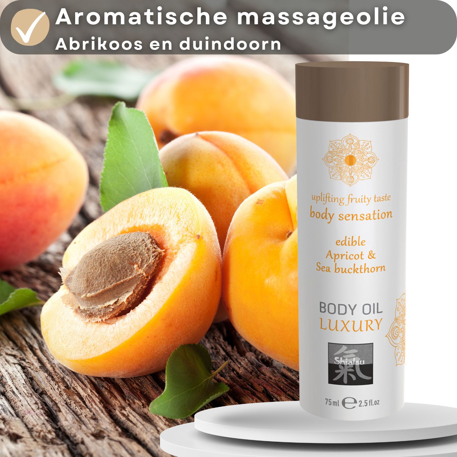 Fles Shiatsu Body Oil Luxury met abrikozen op de achtergrond.
