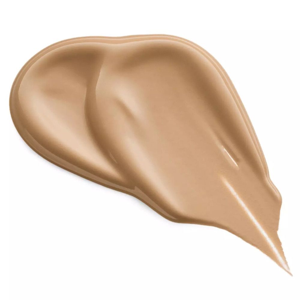 Éclaboussure de correcteur beige clair. Texture brillante. Forme: en forme de goutte.