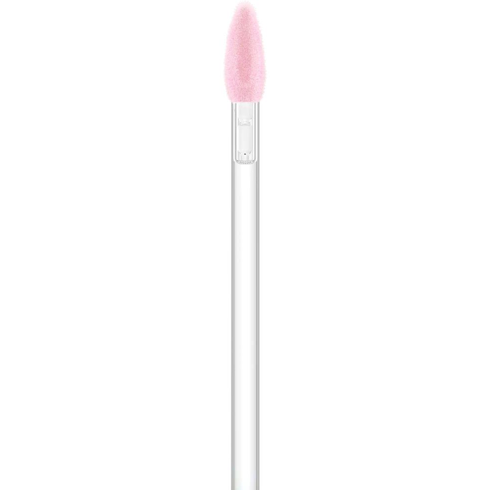 Close-up van een roze lipgloss applicator.