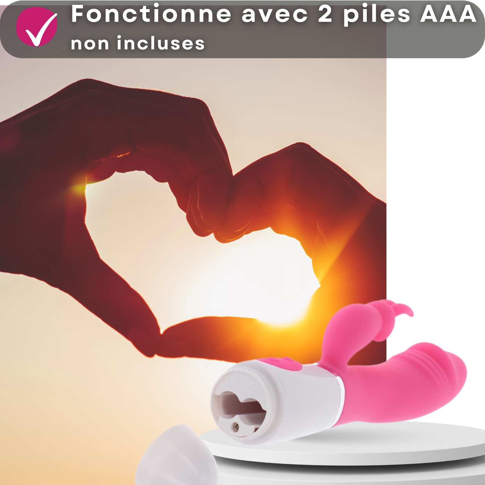 Vibromasseur rose, design lapin. 2 piles AAA requises, non incluses. Silhouette de cœur en arrière-plan.