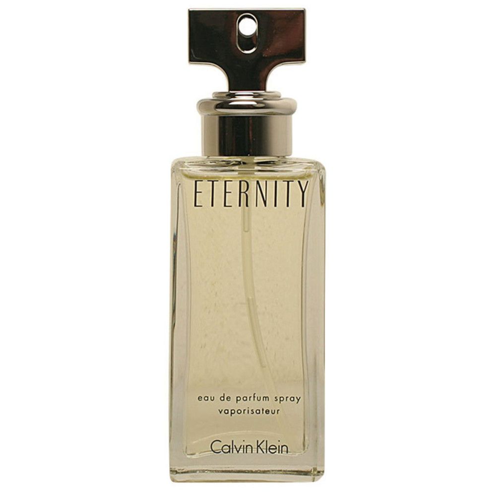 Flacon de parfum rectangulaire avec bouchon argenté. Inscription : Eternity, Calvin Klein.