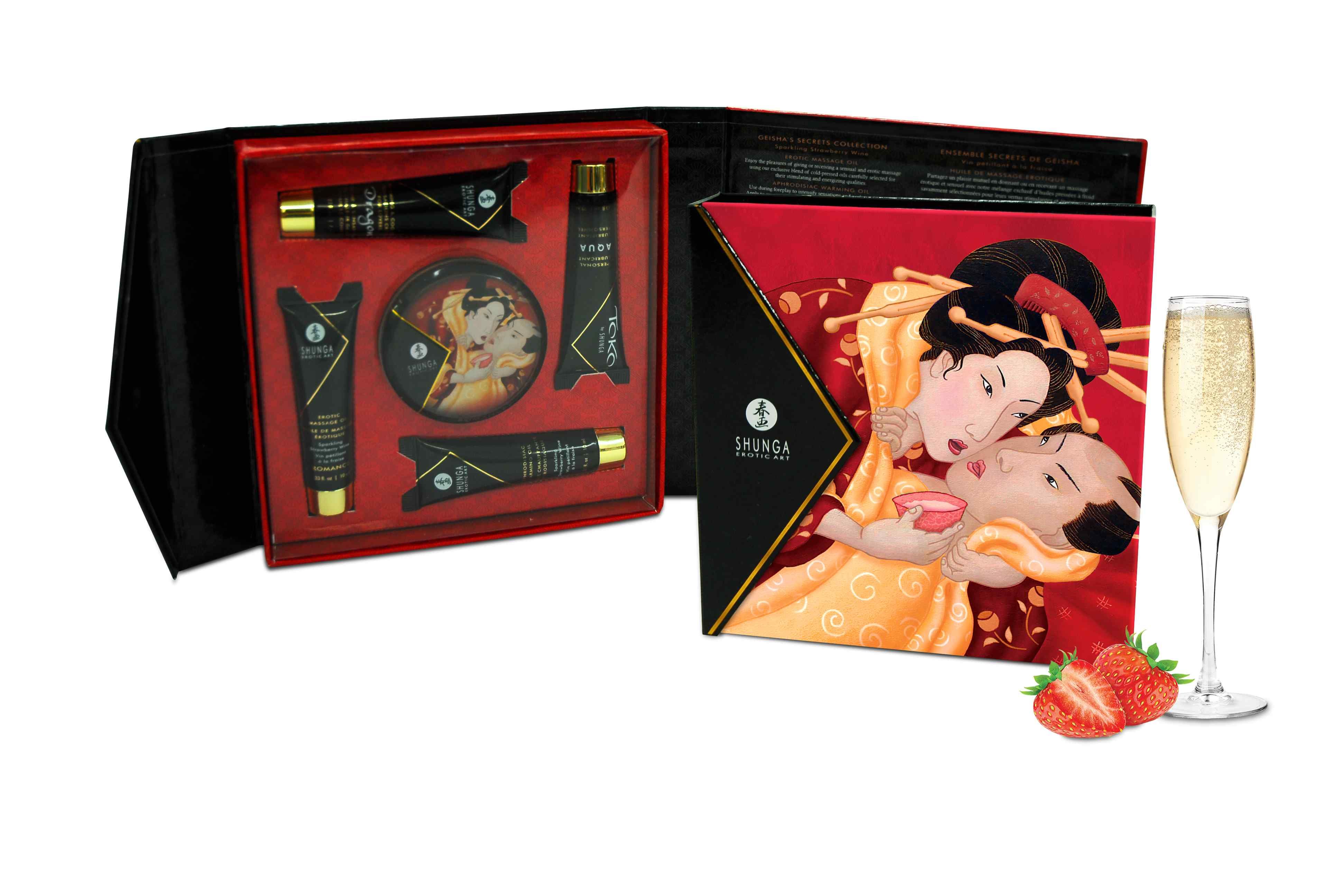 Coffret cadeau avec produits. Crèmes, huile, boîte ronde et bouteille de vin pétillant. Illustration de geisha sur la boîte.