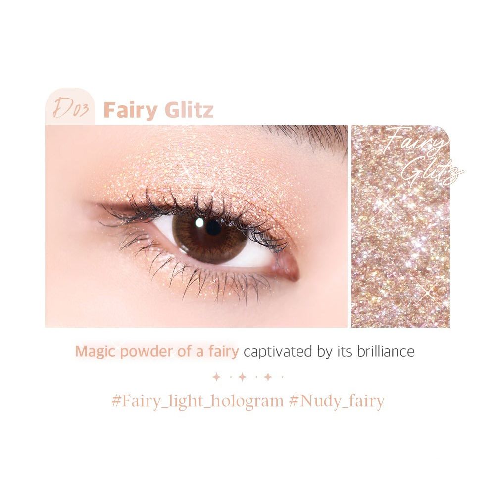 Œil avec fard à paupières Fairy Glitz. Gros plan sur un œil avec fard à paupières scintillant. Nom du produit et teinte.