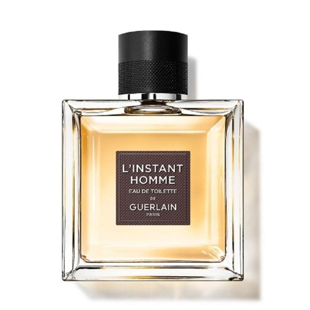 Guerlain l'Instant Homme Eau de Toilette fles. Vierkante glazen fles met bruin etiket en zwarte dop.