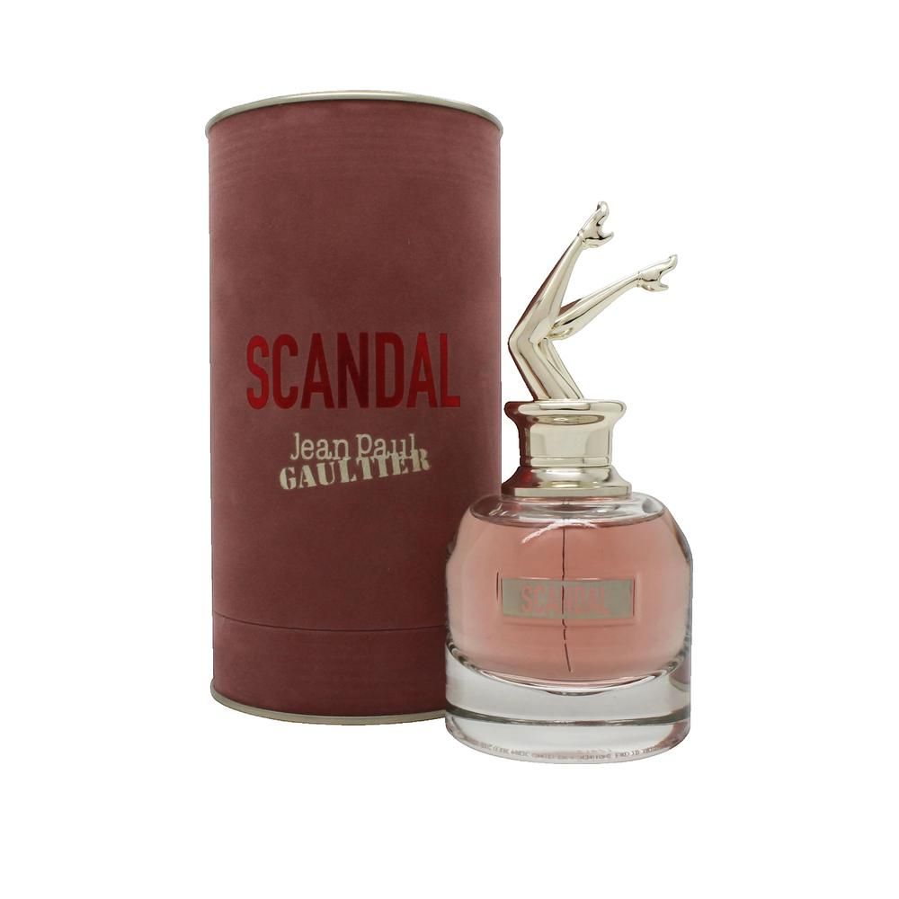 Flacon et emballage de parfum. Flacon avec jambes dorées. Inscription: SCANDAL, Jean Paul Gaultier.