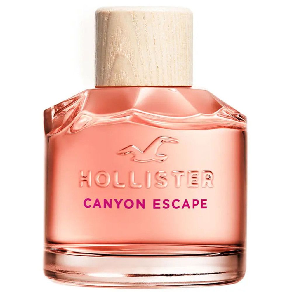 Fles Hollister Canyon Escape Eau de Parfum Spray. Roze vloeistof, houten dop. Logo en productnaam zichtbaar.