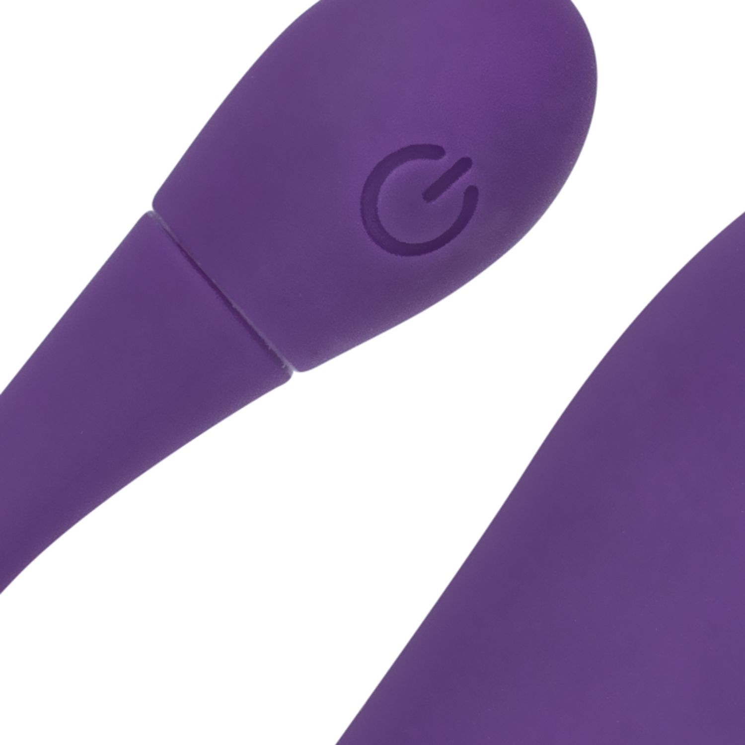 Close-up van een paars wellnessproduct. Zichtbaar: een aan/uit-knop.