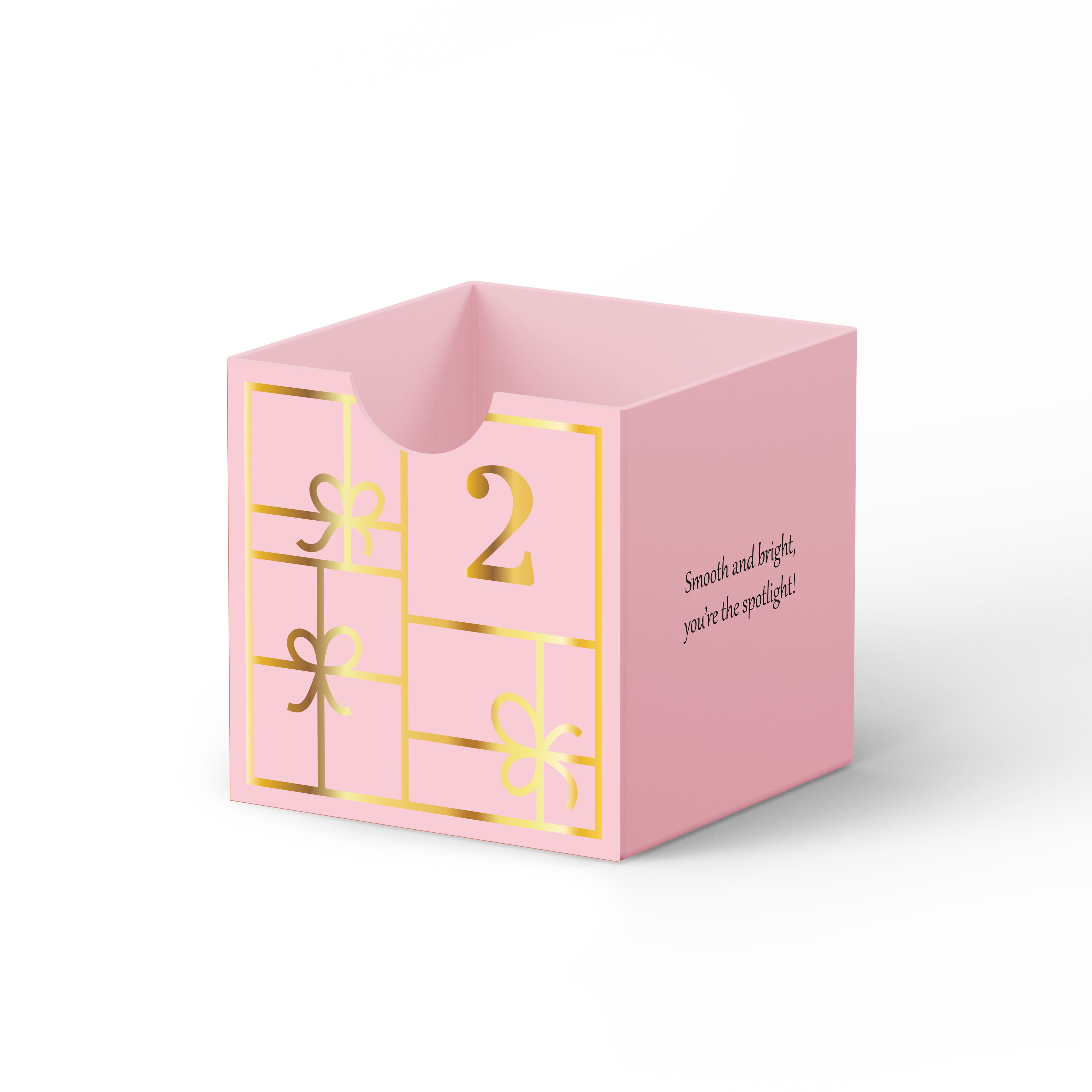 Roze adventskalenderdoos met gouden nummer 2 en cadeauversieringen. Tekst: "Smooth and bright, you're the spotlight!"