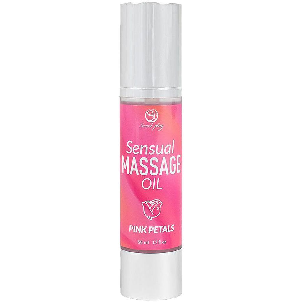 Roze fles met zilveren verstuiver. Opschrift: Sensual Massage Oil Pink Petals. Witte achtergrond.