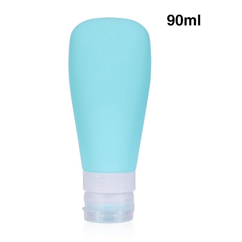 Een enkele turquoise siliconen reisfles van 90 ml met witte en doorzichtige dop.