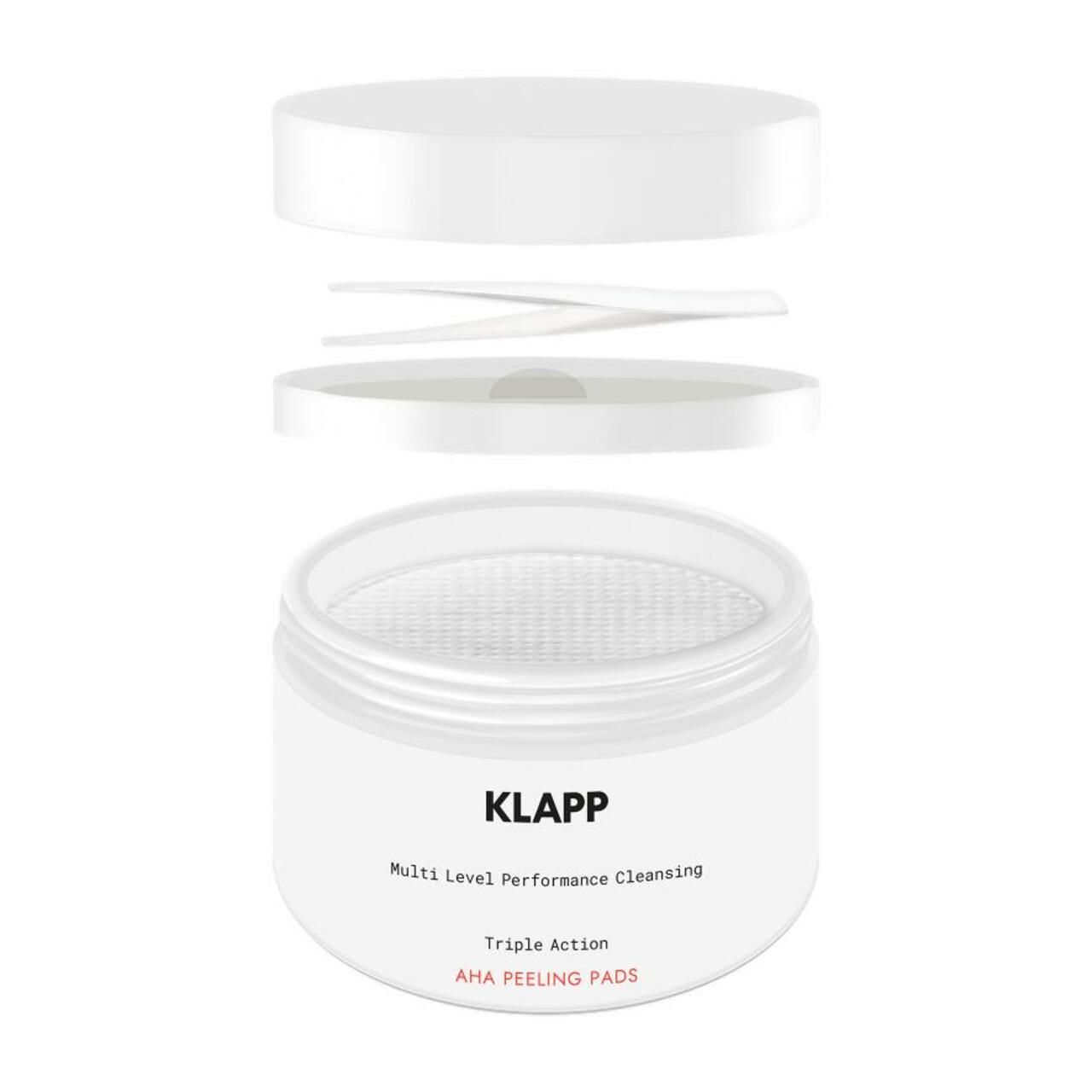 Récipient blanc avec couvercle et tampons. Inscription : Klapp, Multi Level Performance Cleansing, Triple Action, AHA PEELING PADS.