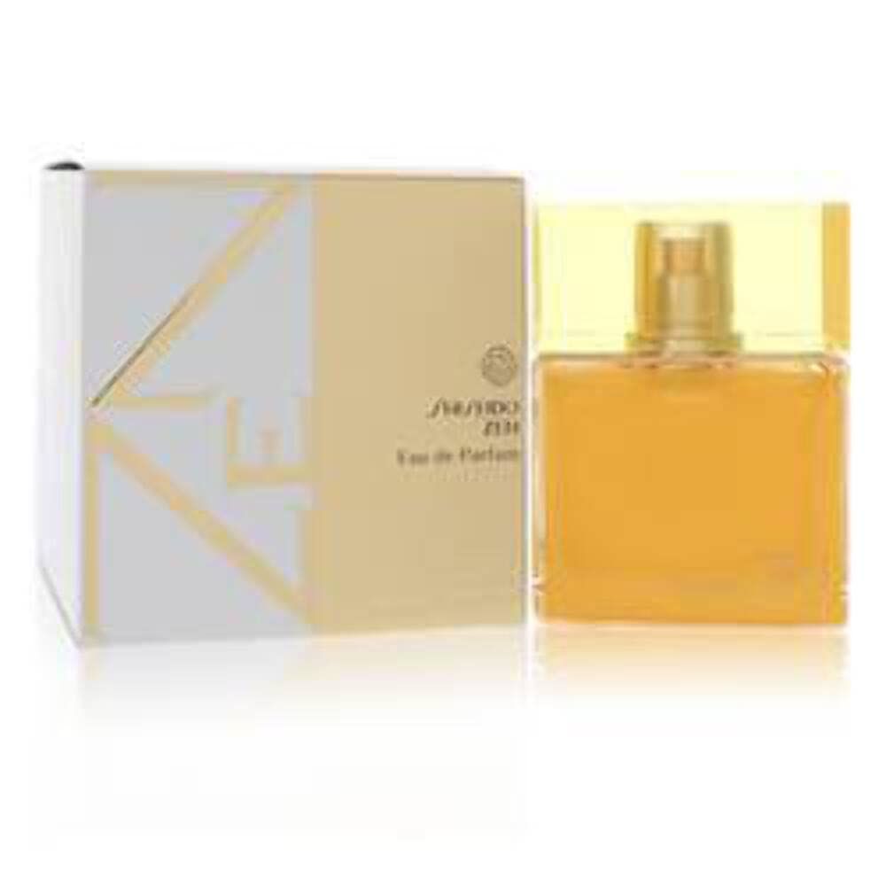 Flacon et emballage Shiseido Zen Eau de Parfum. Flacon carré avec bouchon jaune. Emballage blanc et doré.