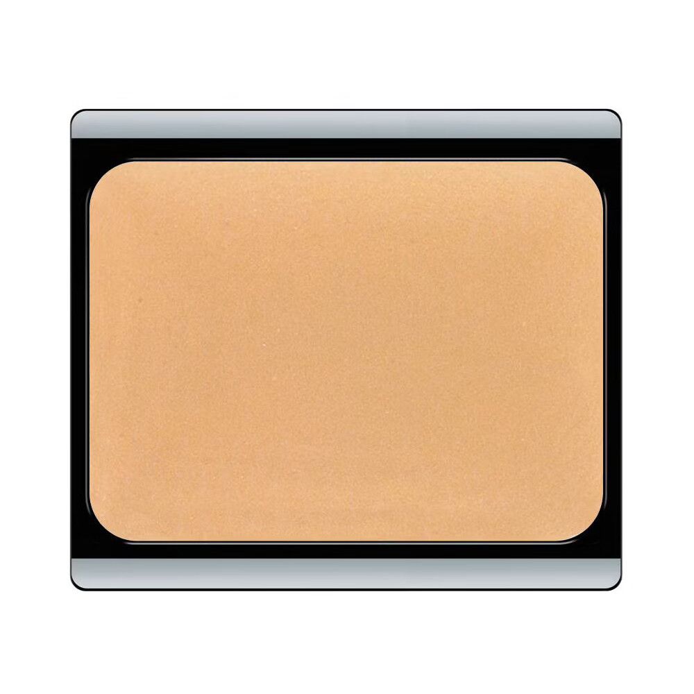 Compacte make-up in rechthoekige verpakking met afgeronde hoeken. Beige-abrikooskleurige crème. Zwarte rand, zilverkleurig deksel.