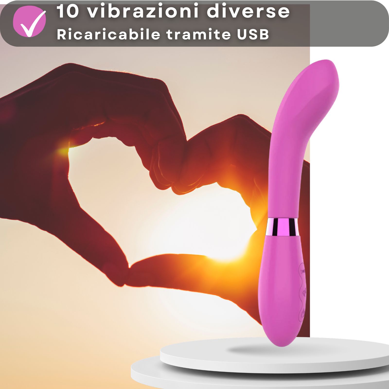 Roze vibrator. Afmetingen: 21cm lang, 3,5cm diameter. Op voetstuk.
