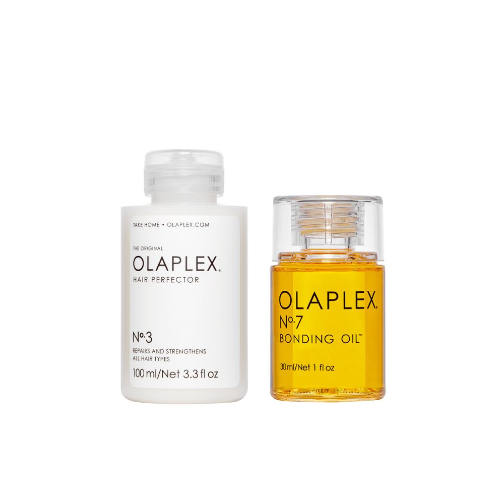 Deux flacons. Un flacon blanc avec "OLAPLEX Hair Perfector No.3". Un flacon jaune avec "OLAPLEX No.7 Bonding Oil".