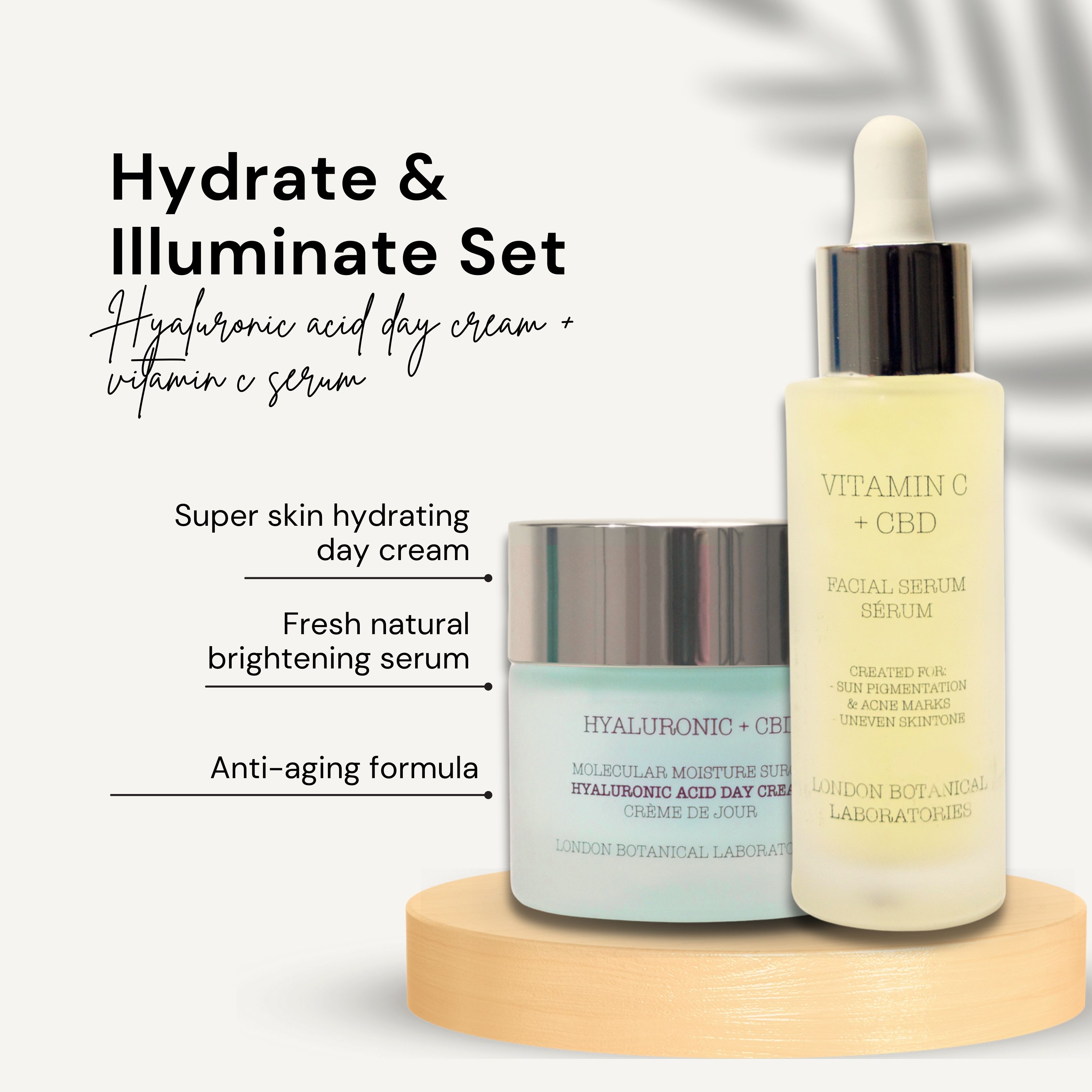 Crème en serum op houten sokkel. Opschrift: Hyaluronic + CBD, Vitamin C + CBD. Tekst: Hydrate & Illuminate Set.