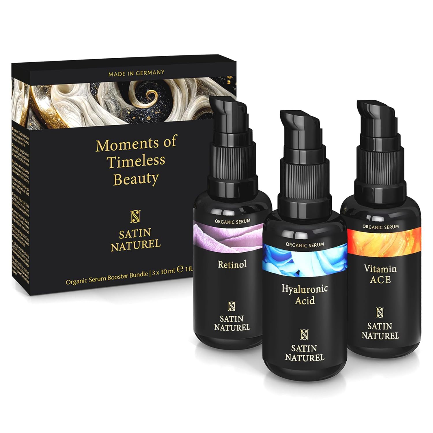 Coffret cadeau noir avec trois flacons de sérum. Inscriptions : Rétinol, Acide Hyaluronique, Vitamine ACE. Texte : Moments of Timeless Beauty.