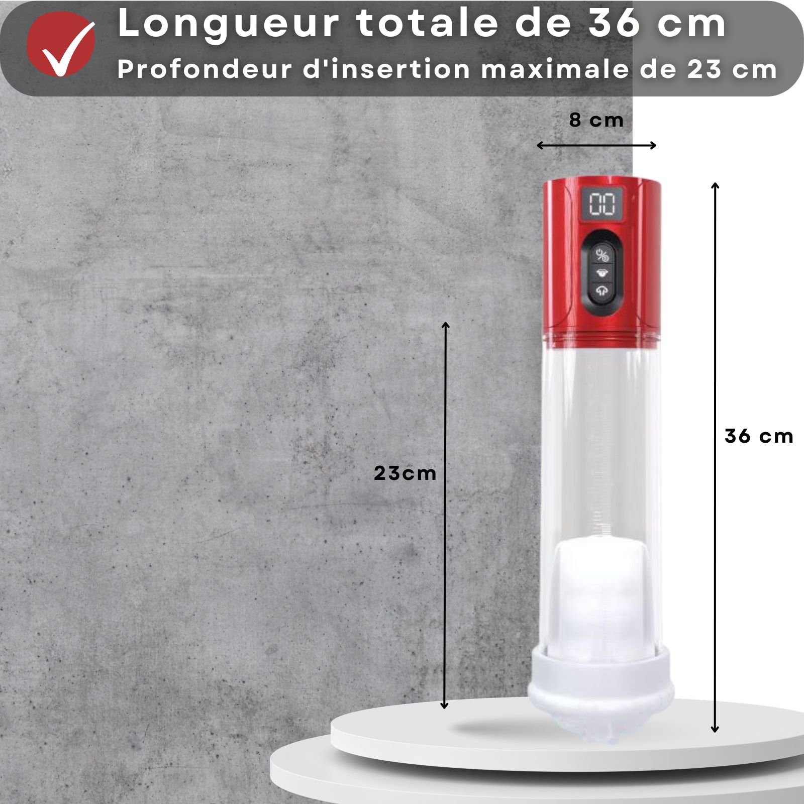 Pompe à pénis avec tête rouge, accessoires et dimensions. Texte: 36cm longueur, 23cm profondeur, 8cm diamètre.