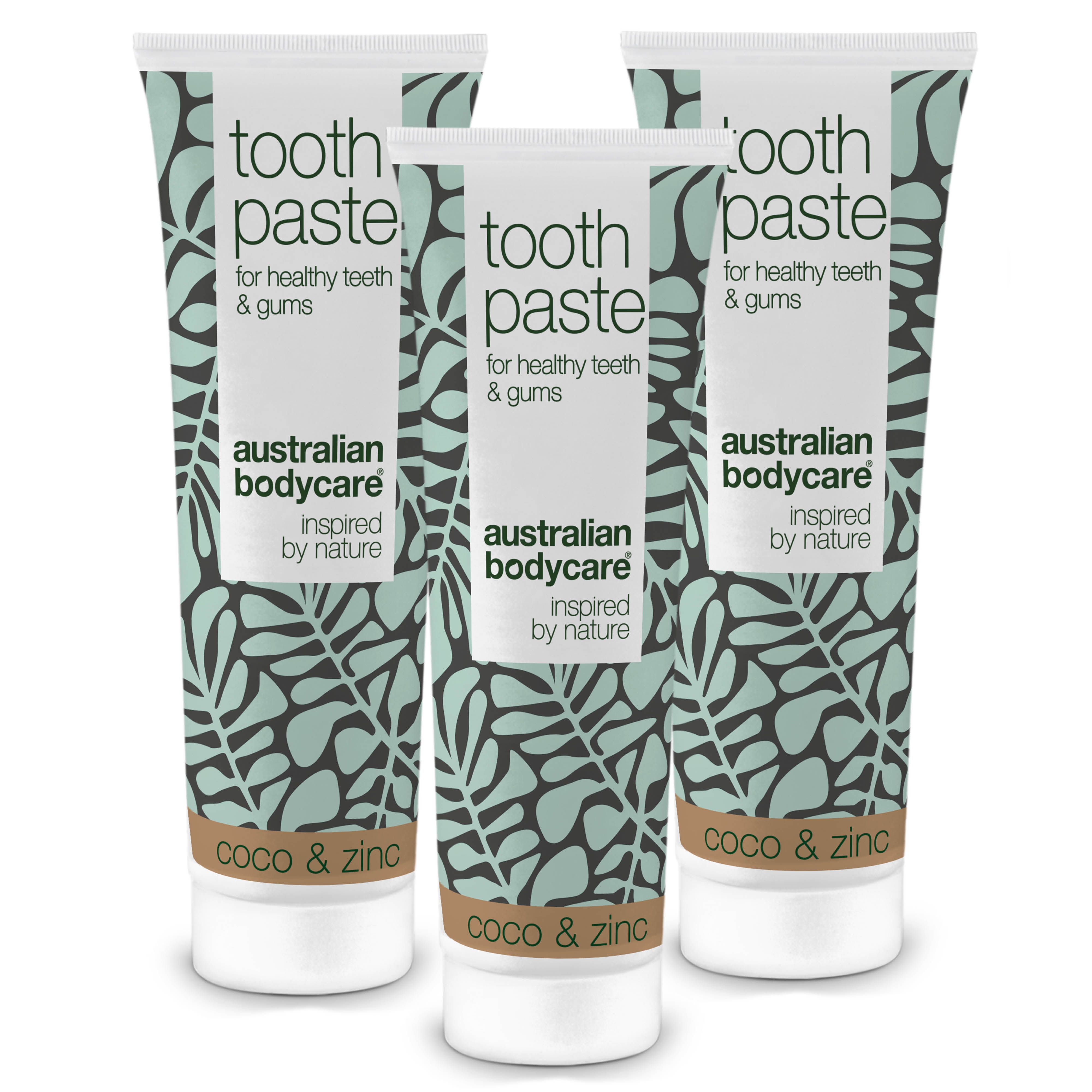 Trois tubes de dentifrice. Design blanc et turquoise avec des feuilles. Inscription : Australian Bodycare, Coco & Zinc.