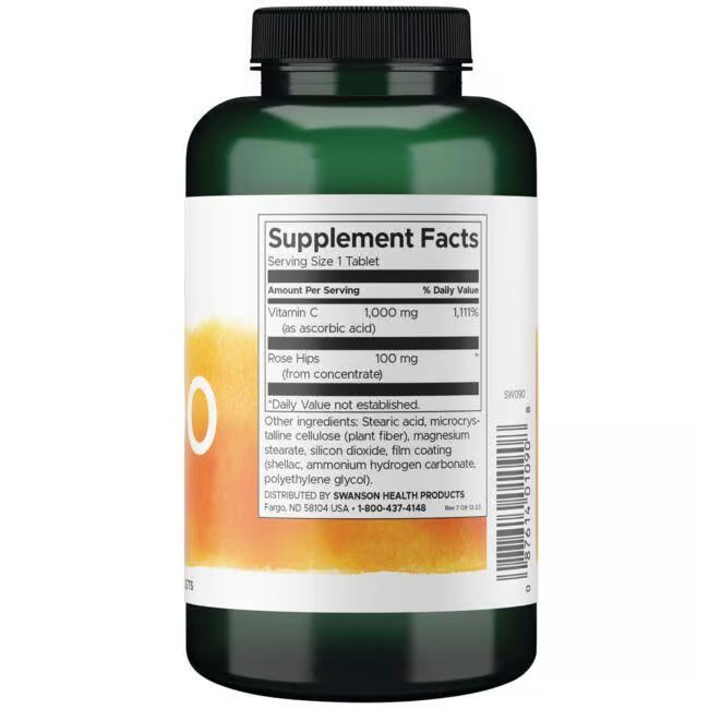 Achterkant van groene fles. Wit etiket met voedingswaarde-informatie. Bevat vitamine C en rozenbottel.