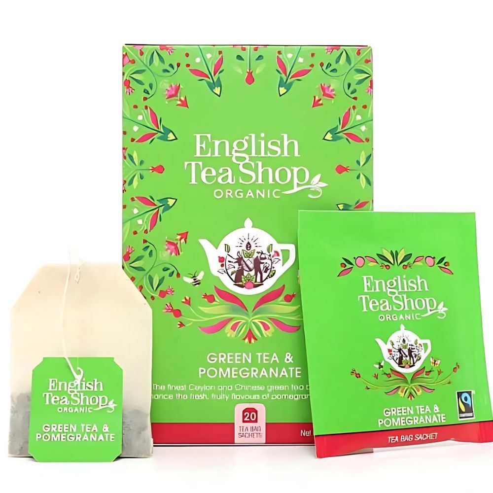 Doos, theezakjes en individueel zakje. "English Tea Shop" logo op doos en zakjes. Tekst: "Green Tea & Pomegranate".