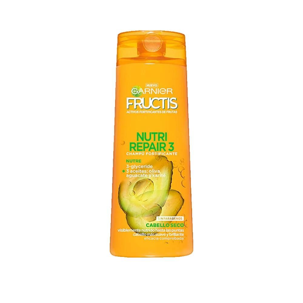 Flacon de shampooing jaune avec logo Garnier Fructis et texte. Illustration d'avocat. Inscription : Nutri Repair 3, Cabello Seco.