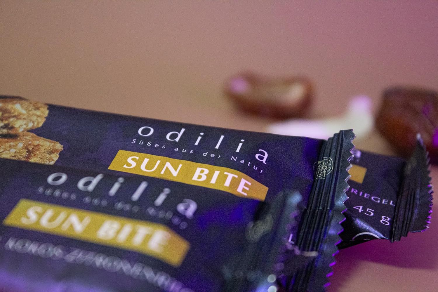 Barre Odilia Sun Bite, 45g. Emballage sombre avec inscription jaune.