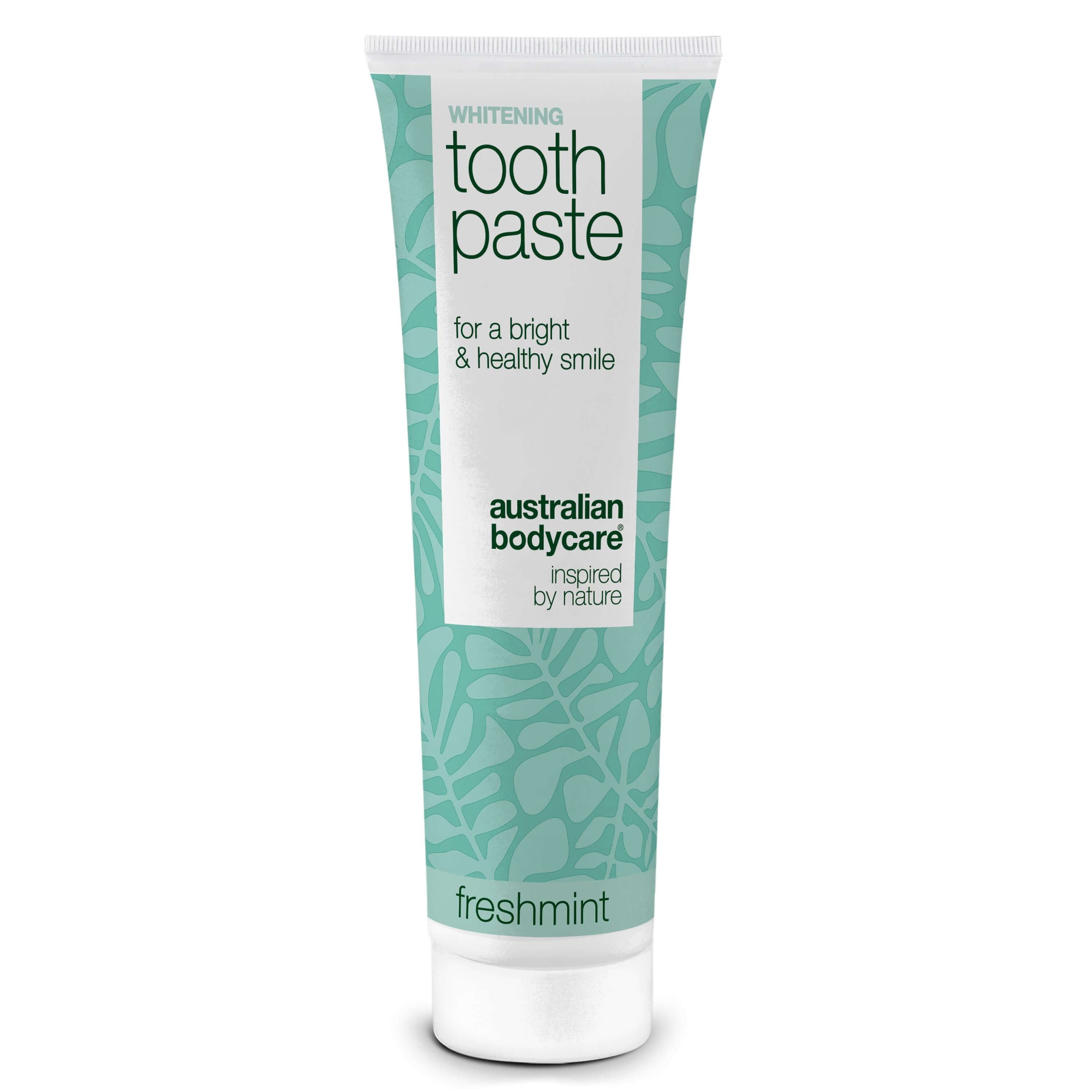 Tandpastatube met bloemmotief. Tekst: Whitening Toothpaste, Australian Bodycare, Freshmint.