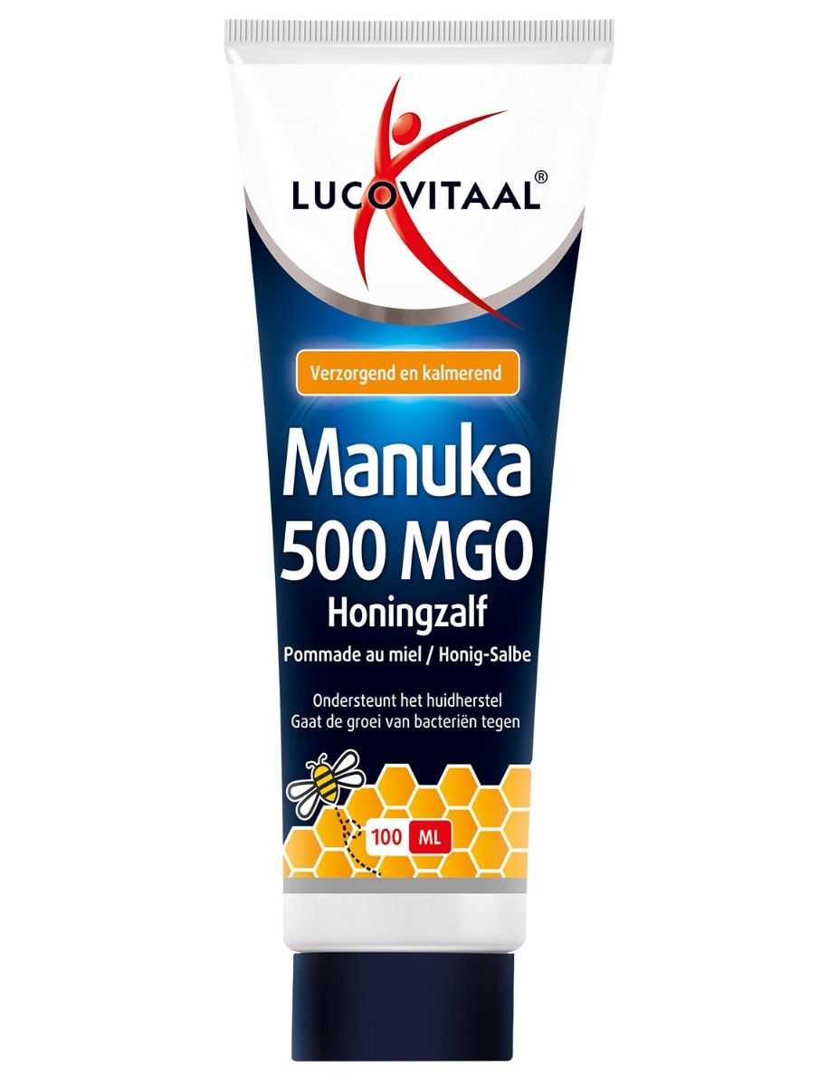 Tube met logo en productnaam. Tekst: Manuka 500 MGO Honingzalf. Oranje strook met tekst. Illustratie van een bij.