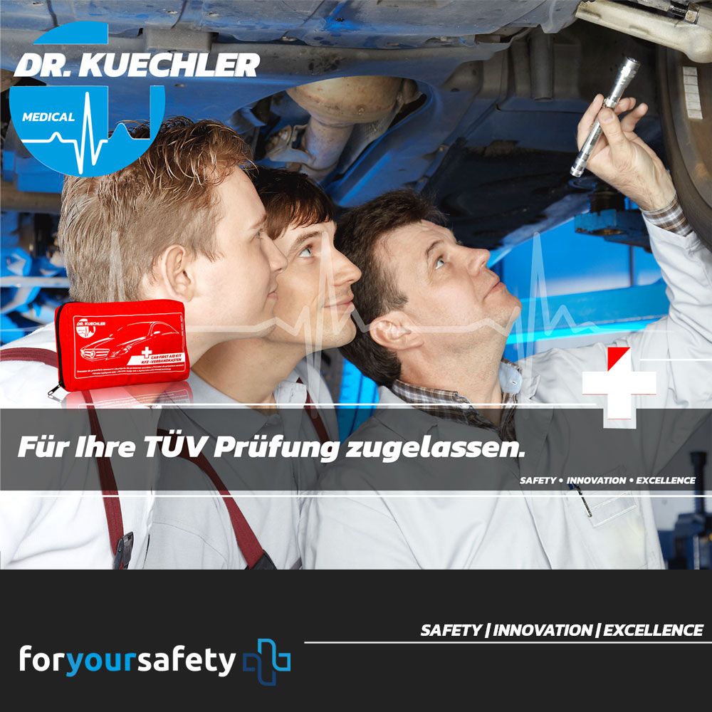 Rode EHBO-tas naast monteurs. Dr. Kuechler Medical® logo.