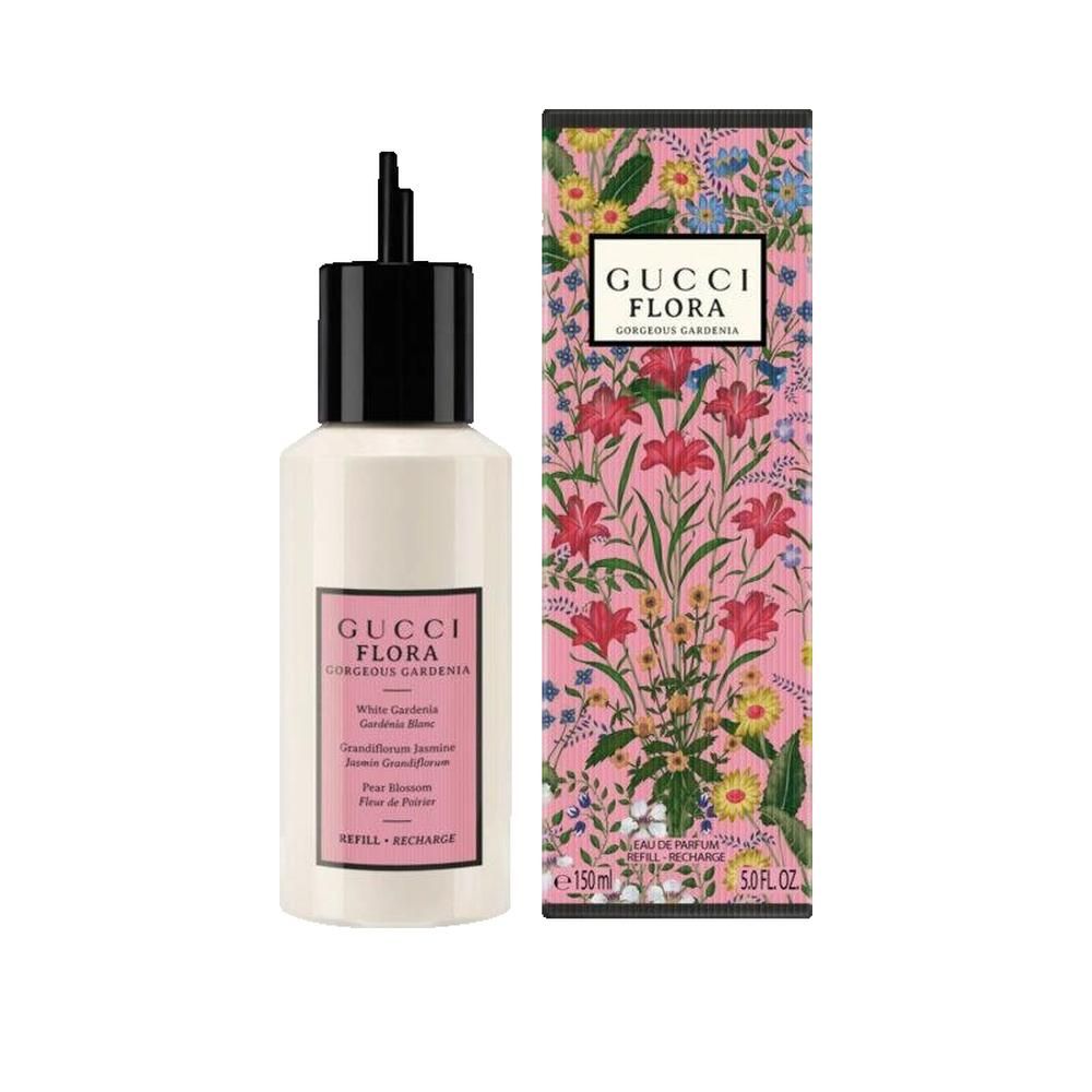 Flacon blanc avec bouchon noir et étiquette rose. À côté, une boîte avec un design floral et le nom du produit.