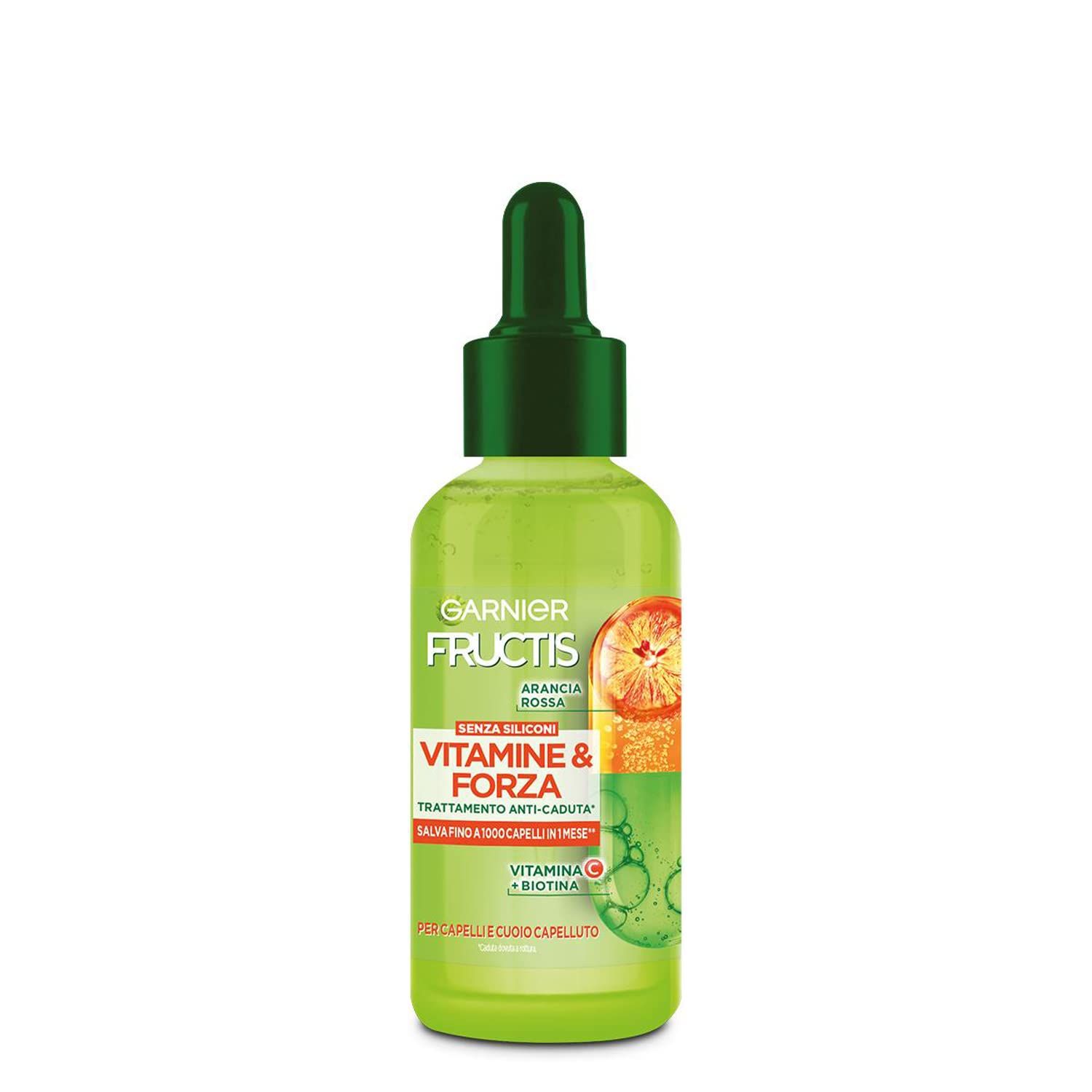 Groene fles met druppelaar. Opschrift: Garnier Fructis Vitamine & Kracht. Anti-haaruitval behandeling. Bevat Vitamine C & Biotine.