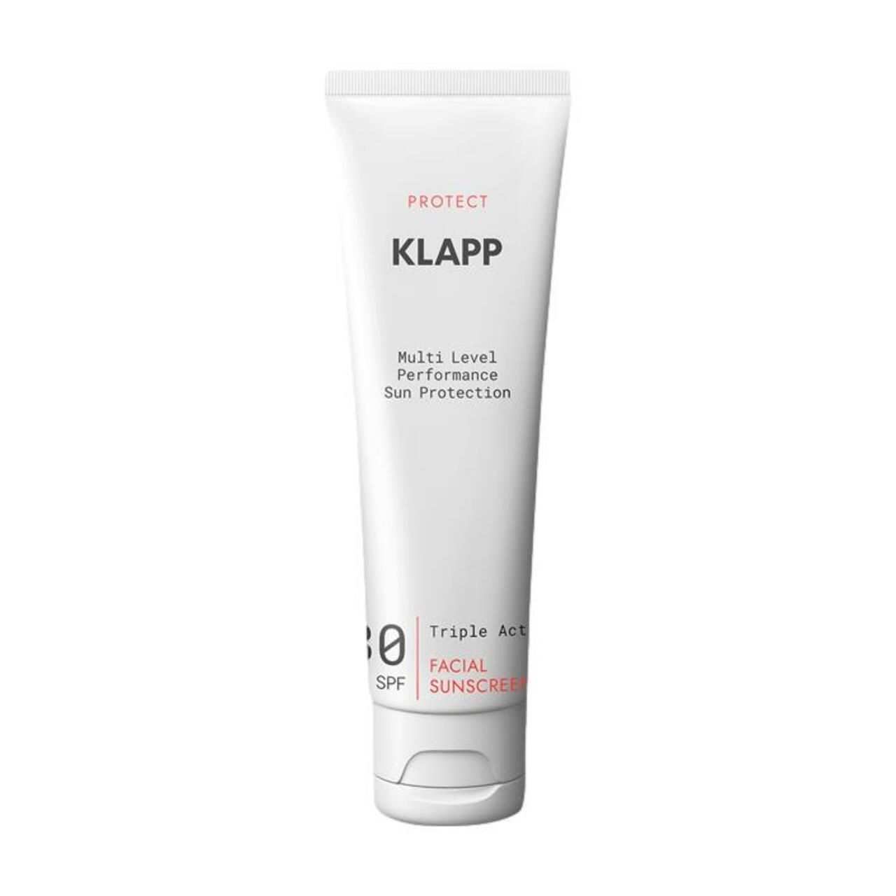 Witte tube met productinformatie. Opschrift: KLAPP, Multi Level Performance, 30 SPF, Triple Action Facial Sunscreen.