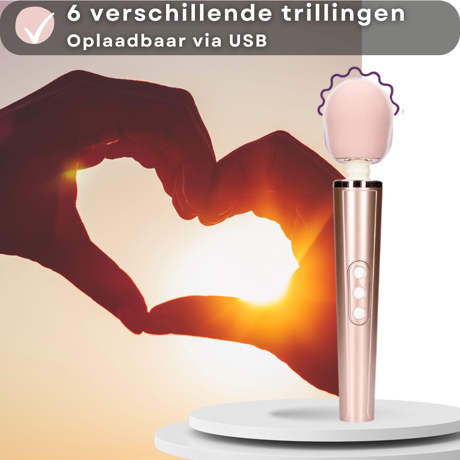 Vibrator, roze. Tekst: 6 verschillende trillingen, USB oplaadbaar. Hartvorm met handen. Roze kop, cilindrische handgreep.