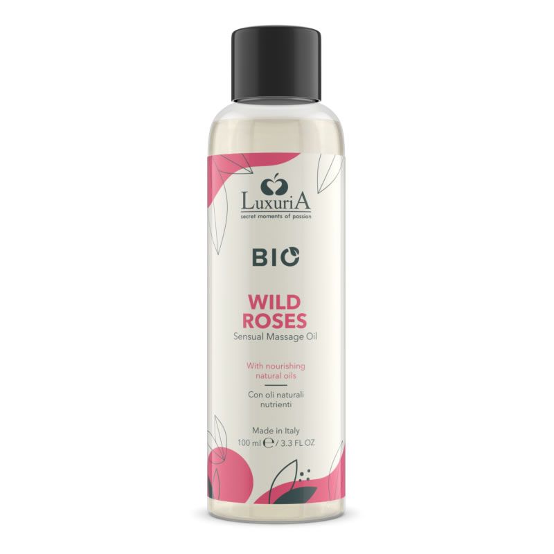Flacon transparent avec bouchon noir. Inscription: LuxuriA BIO, WILD ROSES, Sensual Massage Oil. Fabriqué en Italie.